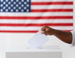 Person depositing voting ballot