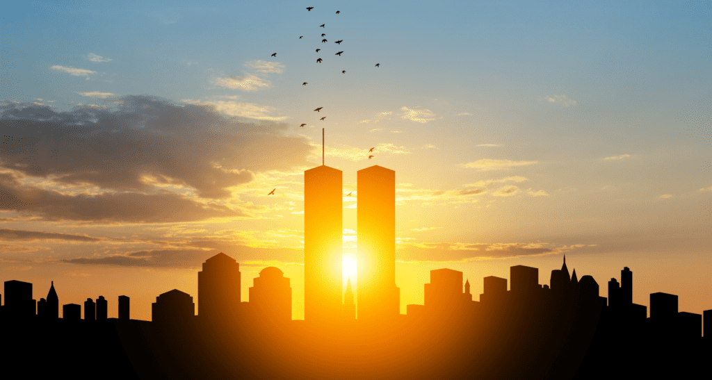 A photograph of the sun shining behind the Twin Towers of the World Trade Center before the terrorist attacks on September 11, 2001